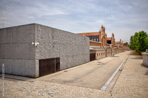 Madrid, Spain - June 1, 2025: Buildings and walkways in the Plaza Matadero along the Rio Manzanares in Madrid in Spain
