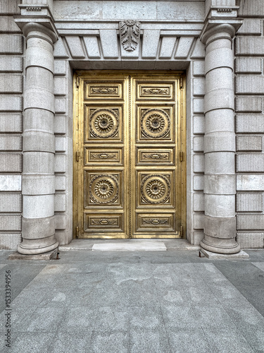 Madrid, Spain - June 1, 2025: A gold exterior door in the Centro district of Madrid in Spain
