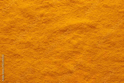 Golden Turmeric Powder: A close-up shot of vibrant, finely ground turmeric powder, the essential spice renowned for its rich color and myriad of culinary and wellness applications.
