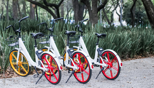 White and red rental bikes parked in mexico city