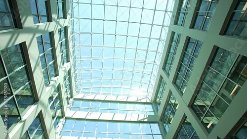 Modern Indoor Courtyard with Glass Ceiling and Skyview for Business or Commercial Use