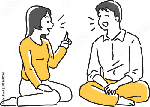 座って楽しく会話するカップル