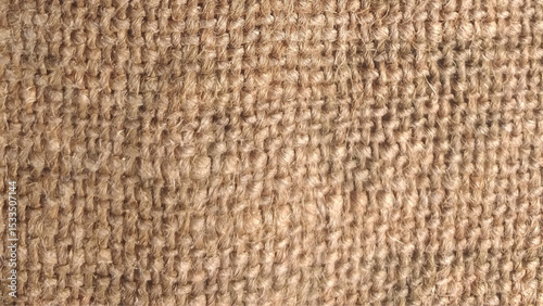 Close-up of fabric woven from burlap. Hessian sack material texture, burlap cloth background