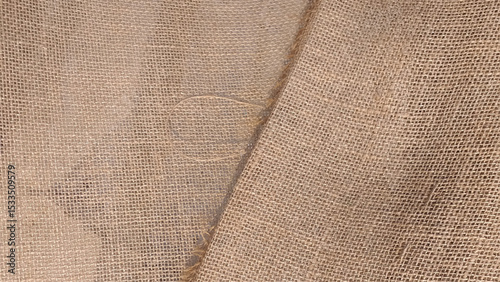 Close-up of fabric woven from burlap. Hessian sack material texture, burlap cloth background