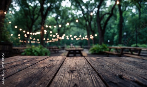 Wallpaper Mural Rustic wooden picnic table in focus, blurry background of outdoor space with string lights and trees at dusk Torontodigital.ca