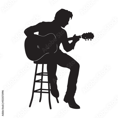 Silhouette of a man sitting on a stool playing acoustic guitar