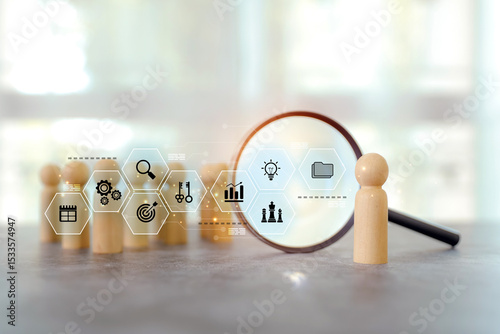 Magnifying glass search wooden person stands with HR human resources icons for personal leader training skill or leadership and challenge business team.