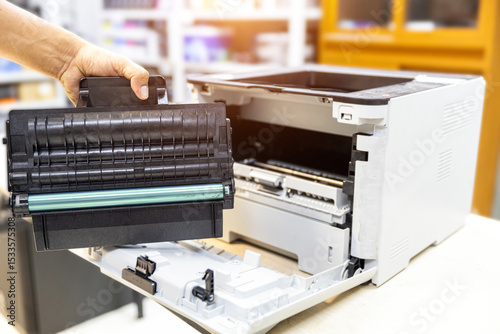 Technician Holding ink printer toner low for replace new or fix repair problem paper or print scanning fax or copy document or photocopier or photocopy office workplace equipment concept