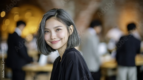 young Asian Thai working woman  in leisure attire at modern office   creative optimistic and confident vibes with gentle smile