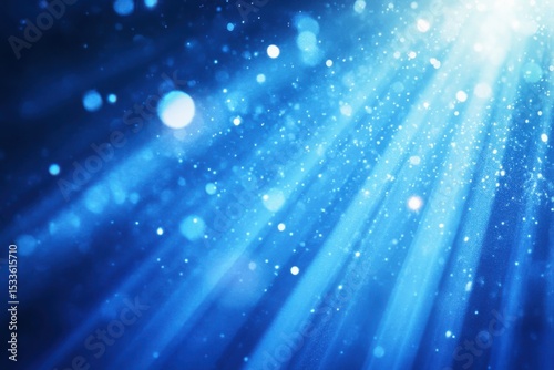 Abstract blue background with light rays and sparkle