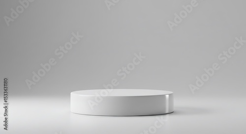 Simple white cylindrical product display platform on a light gray background