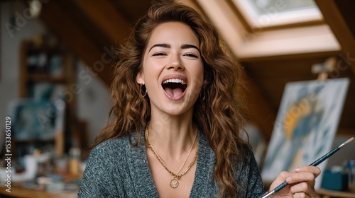 Woman laughing in art studio