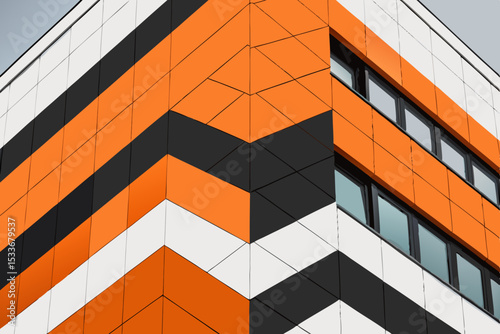 Create a sharp, angular vector design layout featuring contrasting orange and black elements.  Emphasis on geometric shapes and a modern aesthetic.