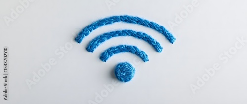 Creative blue yarn Wi-Fi symbol on minimalist white background

 photo
