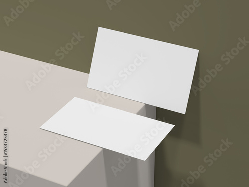 Dual business card mockup with one card leaning against olive wall