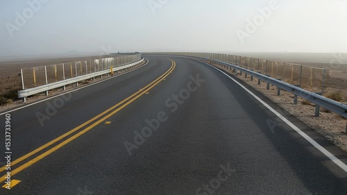Highway curve with guardrail