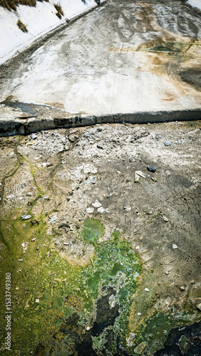 Dry Polluted Canal with Algae.