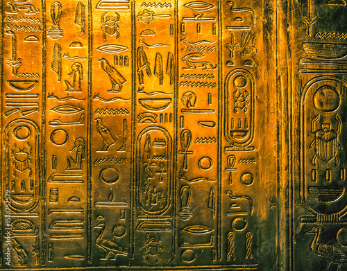 Egyptian hieroglyphics on golden plate from king Tutankhamun tomb
