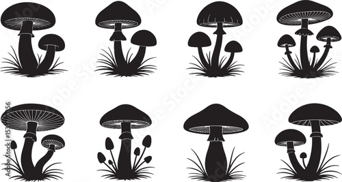 Simple black and white silhouette collection of various mushroom types with grass elements