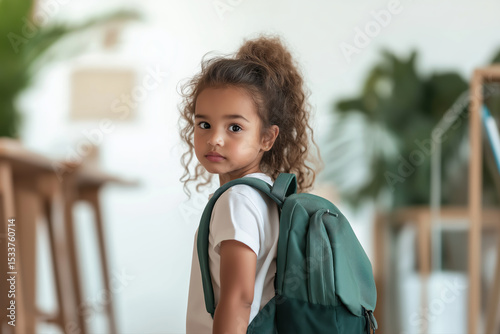 girl go to school with backpack