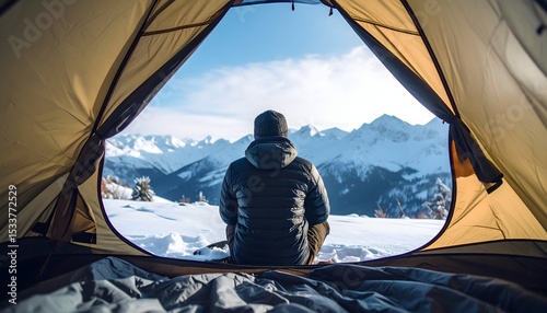 Faceless Camper Sitting in Tent Opening Watching Snowy Viewpoint