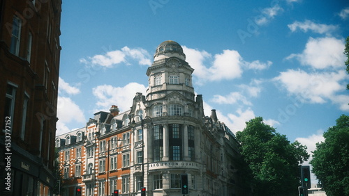 A highly detailed, professional photograph of a building with a clock on the top of it captured with artistic lighting and excellent composition. the scene features  under calm and cool conditions.