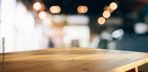 Light wood table with bokeh cafe background