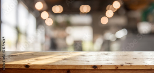 Light wood table with bokeh cafe background