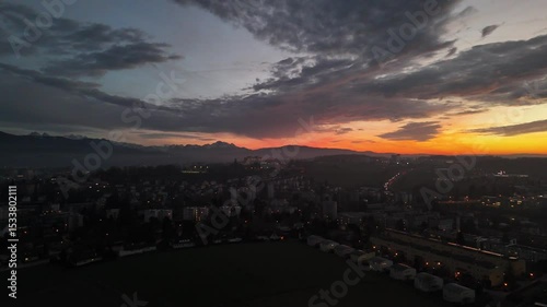 Sunset Aerial View of Fribourg Area with City Lights, Switzerland
