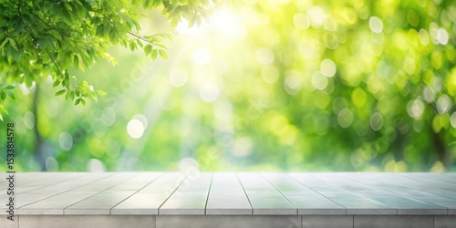 Serene spring scene empty light gray wood tabletop against a bokeh background of sunlit green foliage
