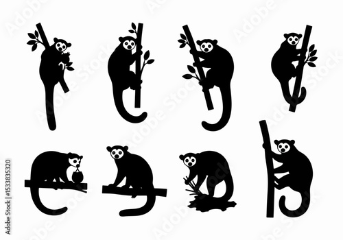 Silhouettes of lemurs holding onto trees