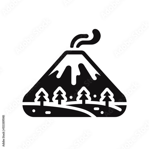 Volcanic mountain emitting smoke with trees in foreground  