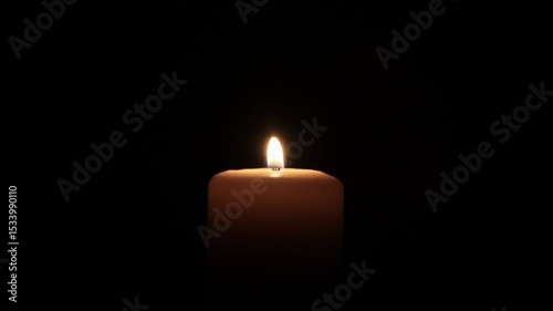 candle on black, close up
