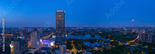 Aerial view of skyscrapers with beautiful lake garden at dusk, Jiading central district, Shanghai.