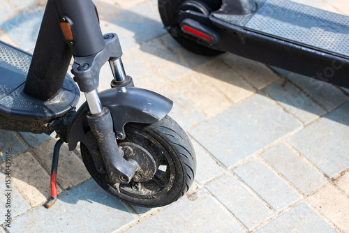 Close up of an electric scooters front wheel, highlighting its design