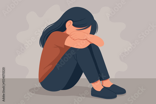Sad lonely girl sitting on the floor, crying. Concept of depression, mental health issues, grief, and anxiety. Unhappy woman feeling despair and stress. Victim of bullying or abuse.
