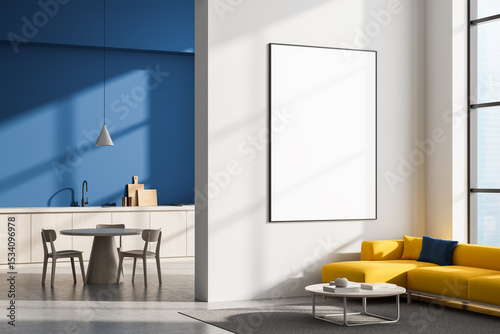 Modern living room and kitchen interior with yellow sofa, round table, and large blank framed poster on white wall for mockup display concept. 3D Rendering