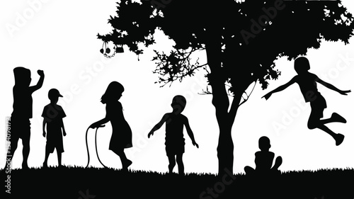Silhouette of Children Playing Under a Tree with Hanging Ornaments.