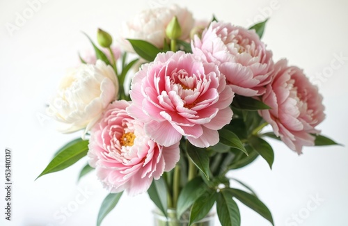 Elegant spring bouquet of pink, white peonies flowers. Soft petals, green leaves, delicate composition ideal for wedding, gift. Floral design for celebration. Beauty of nature, fresh aromatic flowers.