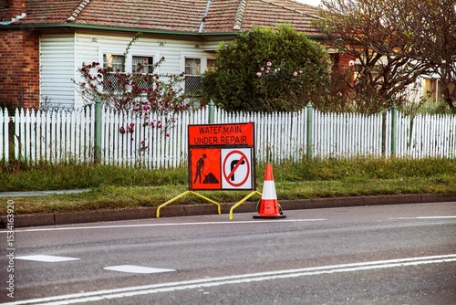 Water Main under repair sign on the roadside