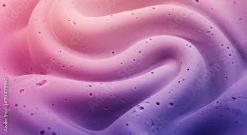 Close-up of textured swirl, pink to purple gradient. Small holes and a textured surface add depth.