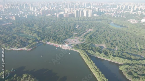 Early morning aerial view of Shenyang Beiling Park, China, featuring the lake, trees, and surrounding urban landscape