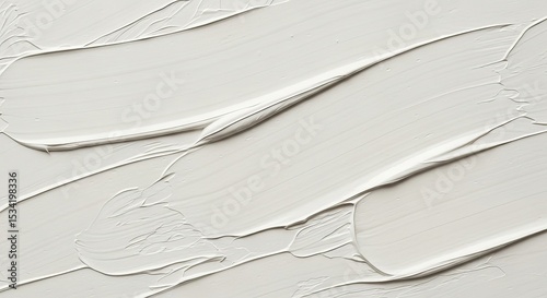 Abstract close-up of thick, creamy white paint strokes creating a textural, flowing surface