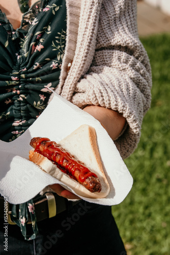 Sausage in bread with sauce.