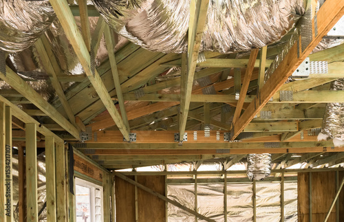 Residential building extension showing air conditioning ducts, timber framing and wall linings photo