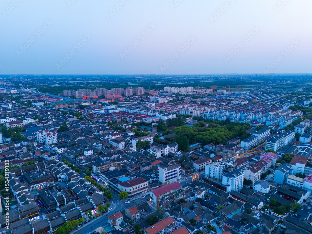 Fototapeta premium Aerial view of Shanghai Xinchang Ancient Town at sunset, One of the most famous ancient towns in Shanghai.