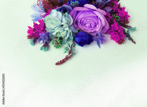 A summer bouquet with roses in lilac tones.  A flower arrangement with a place for text.