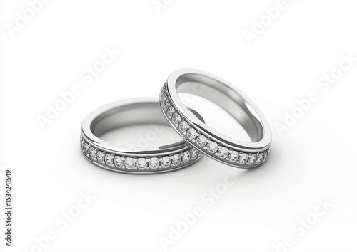 A close up shot of two silver rings with diamonds on a white background studio shot for jewelry