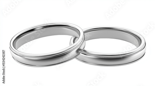 Close up of two silver wedding bands overlapping on a plain white background in a studio shot