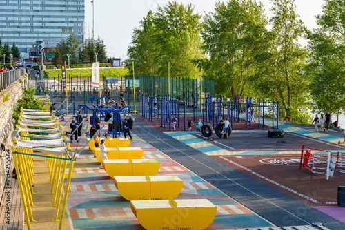 sports ground for workout in city, random people, urban architecture